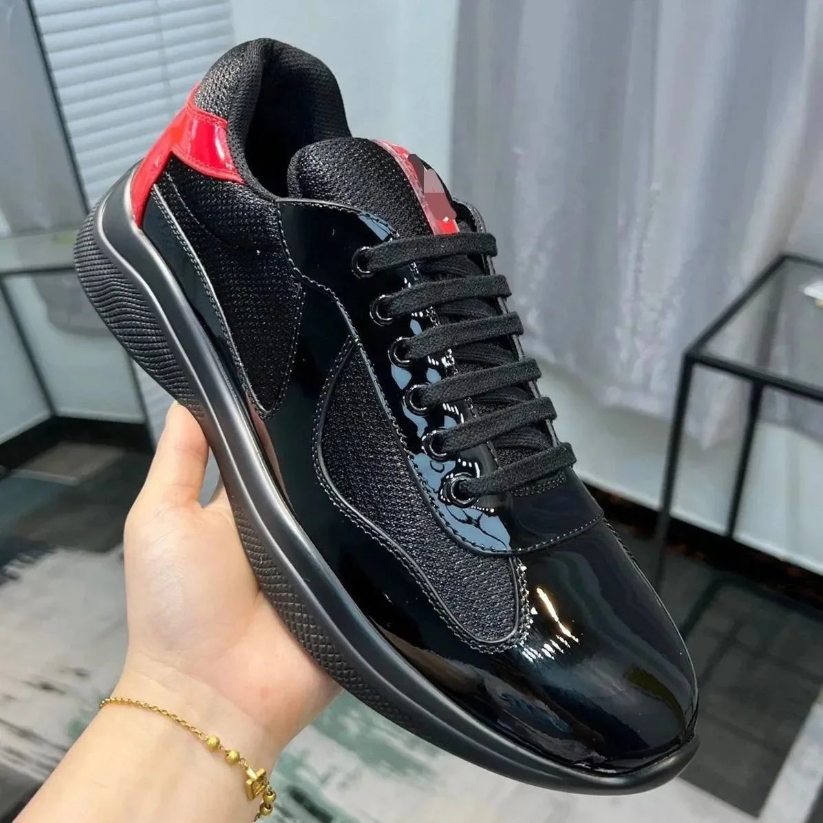 Prada Black Patent Leather Sneakers with Red Accents