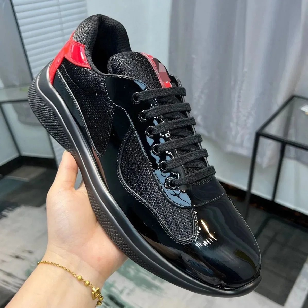 Prada Black Patent Leather Sneakers with Red Accents