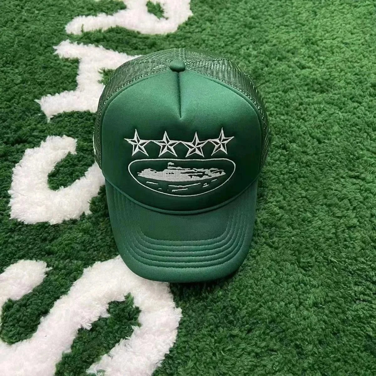 Green Trucker Hat with Embroidered Stars and Oval Design