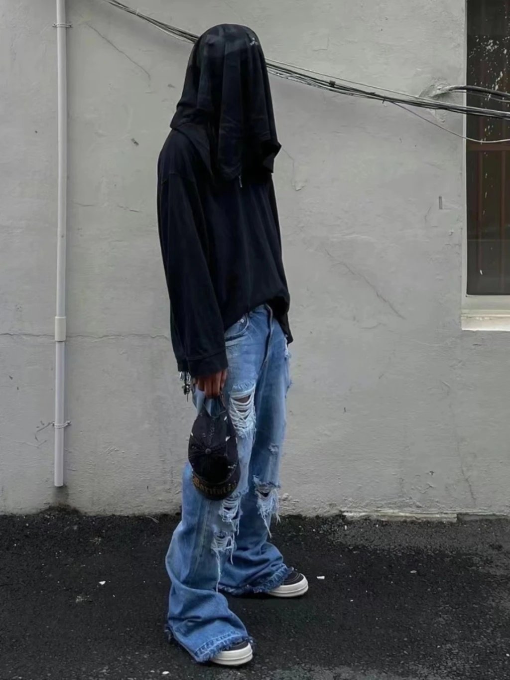 Black Oversized Hoodie with Blue Distressed Jeans