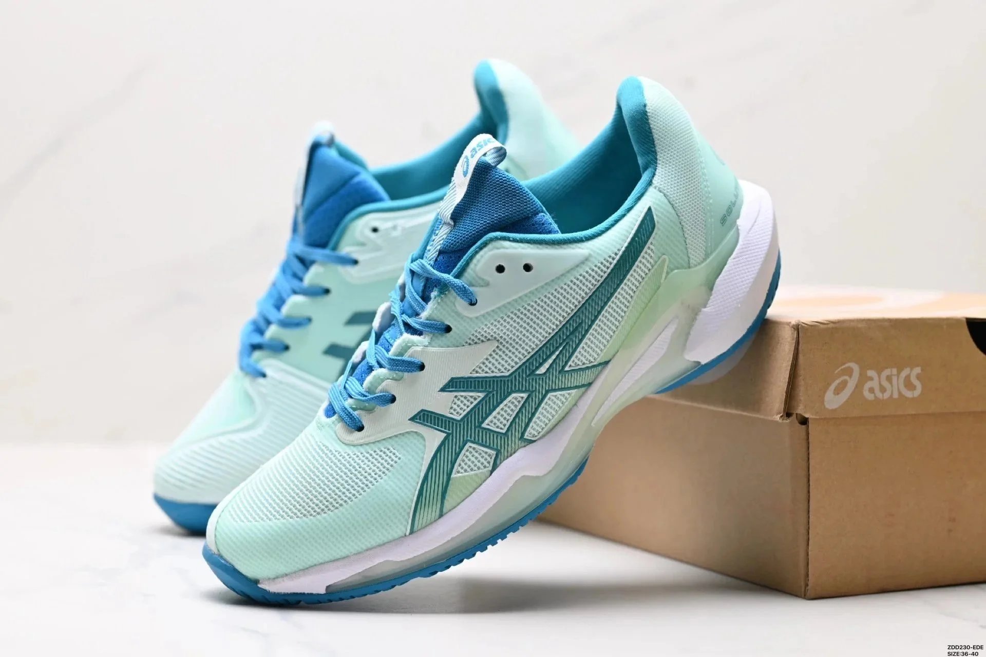 ASICS Light Blue and Teal Running Shoes