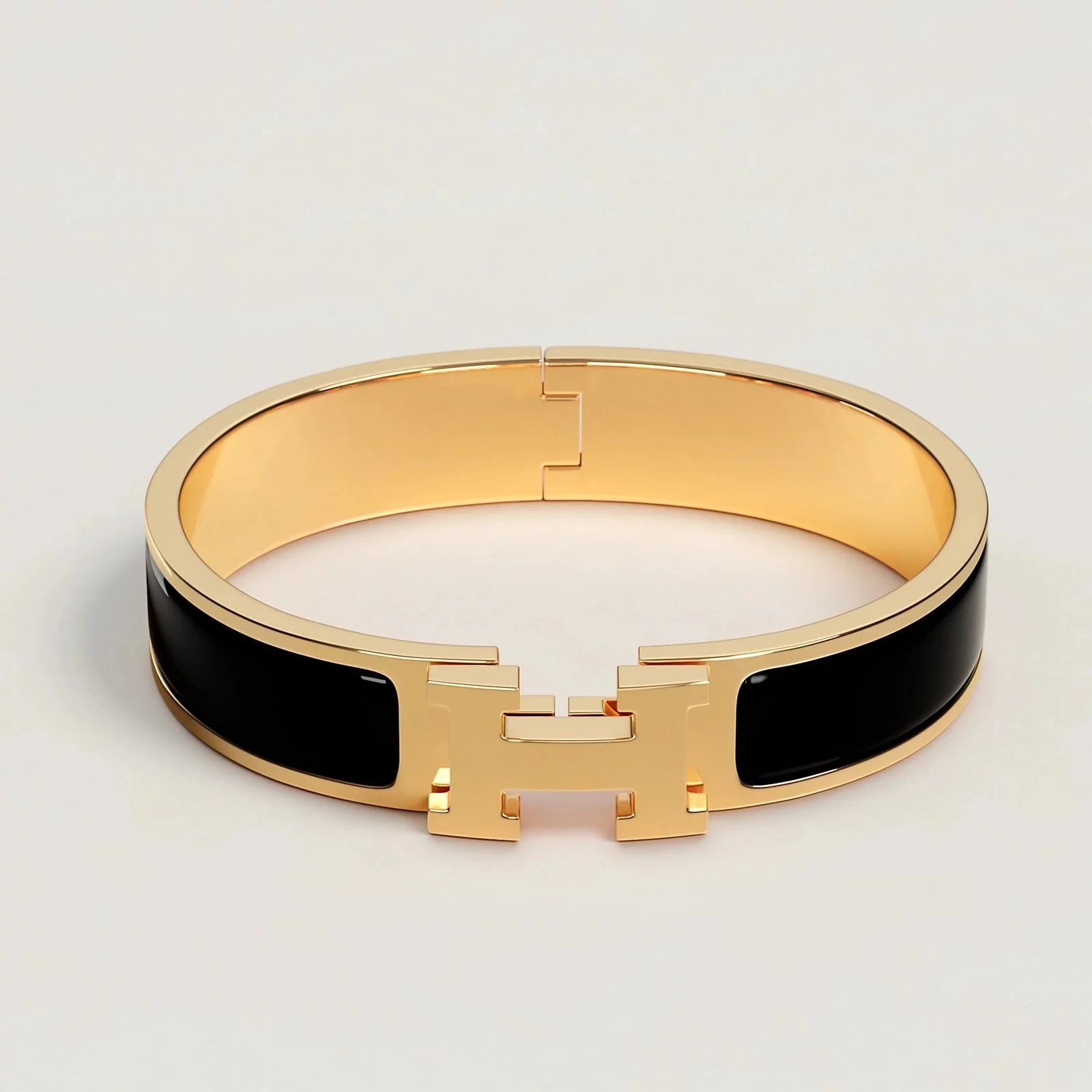 Hermès Black and Gold Clic H Bracelet