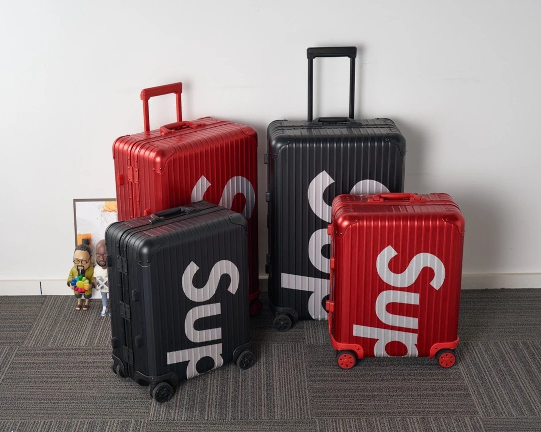 Supreme Red and Black Rolling Suitcases