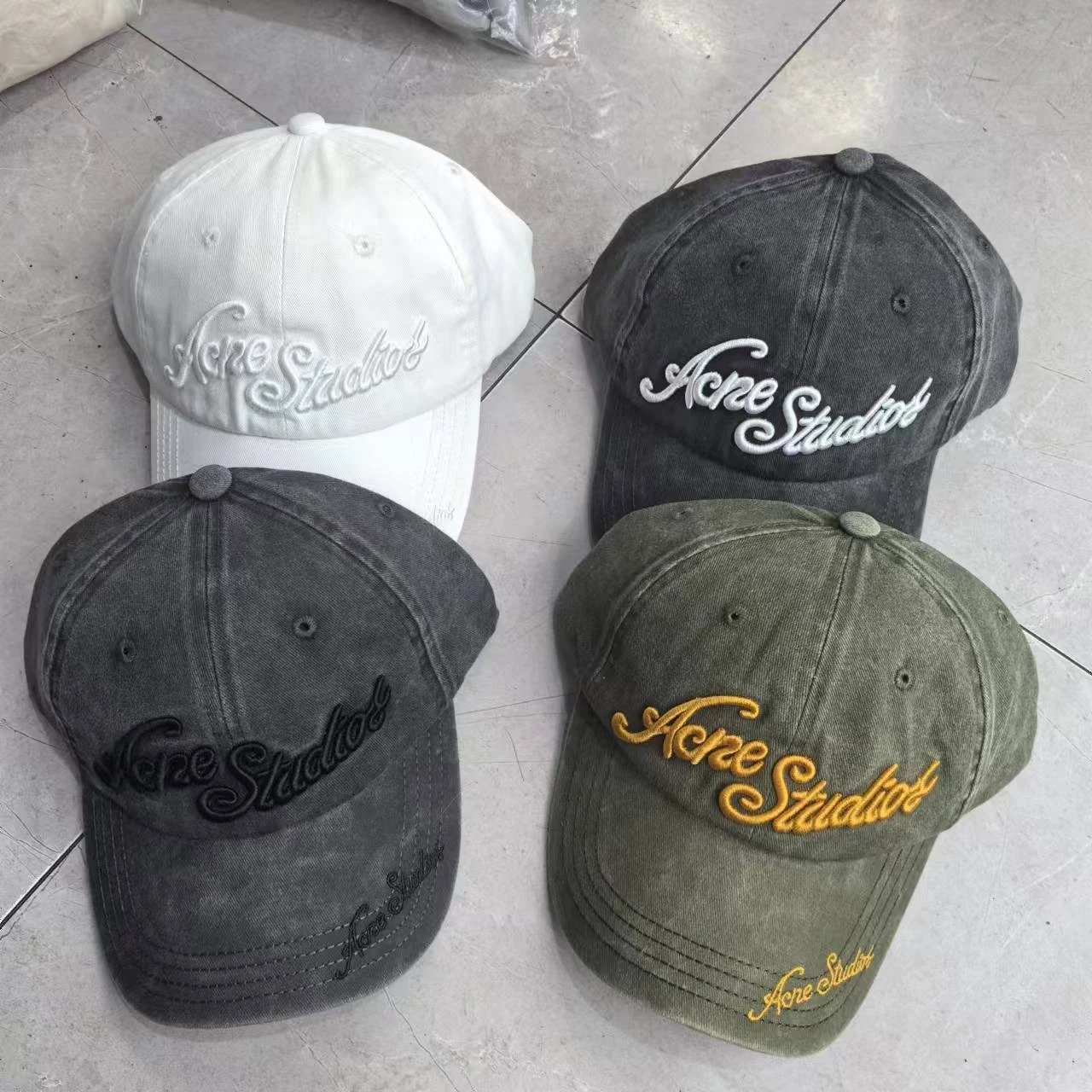 Acne Studios Baseball Caps in White, Black, Grey, and Olive