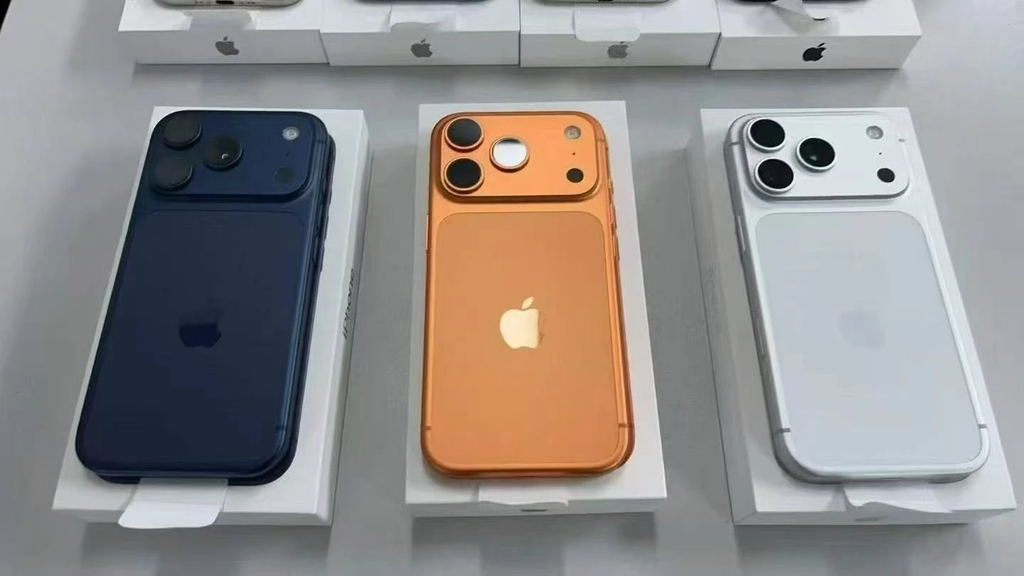 Apple iPhone 15 Pro Max in Blue, Orange, and White